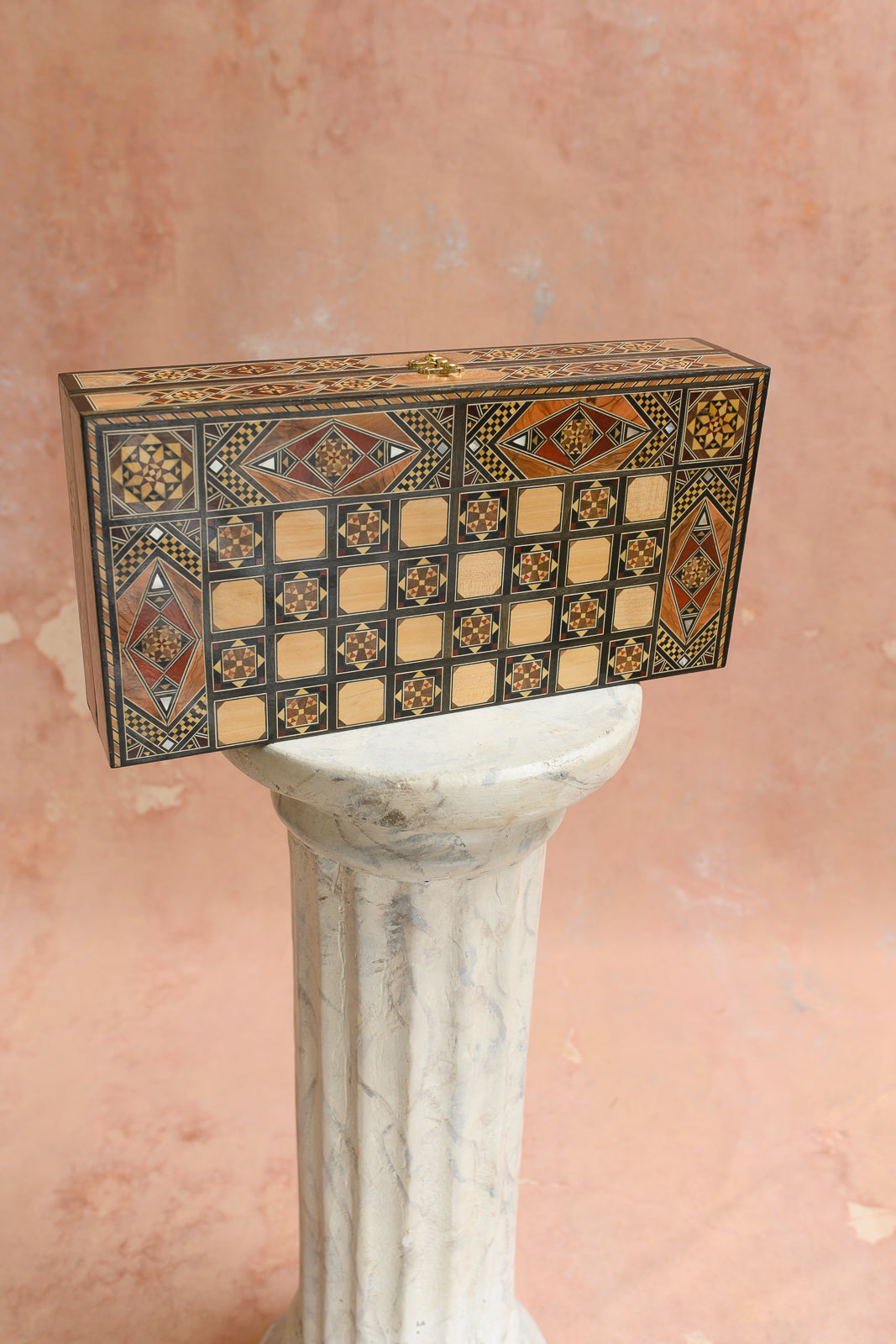 Side view of Damascus marquetry backgammon and chess set with brass clasp
