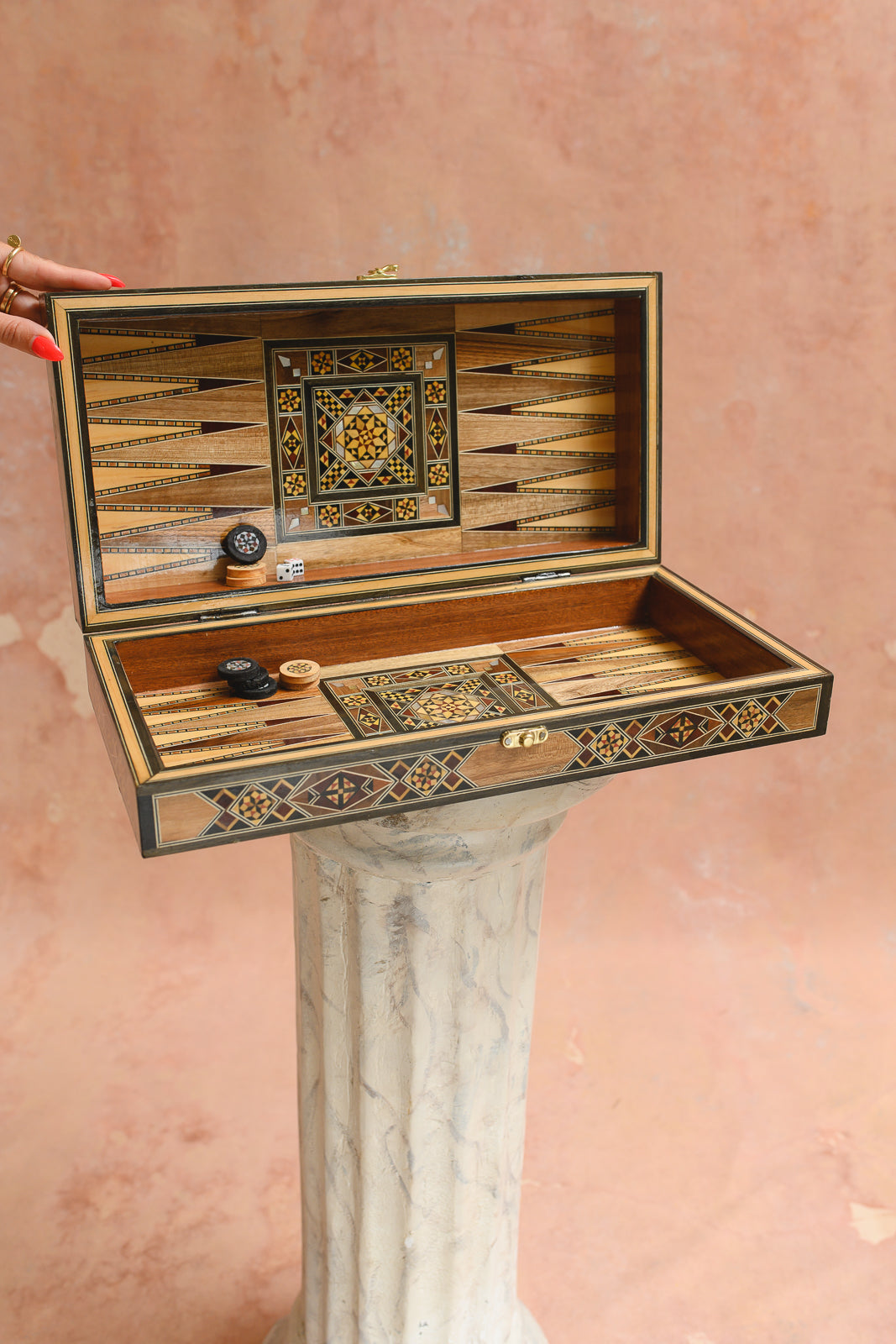 Damascus backgammon board open, showing star medallion marquetry and game pieces