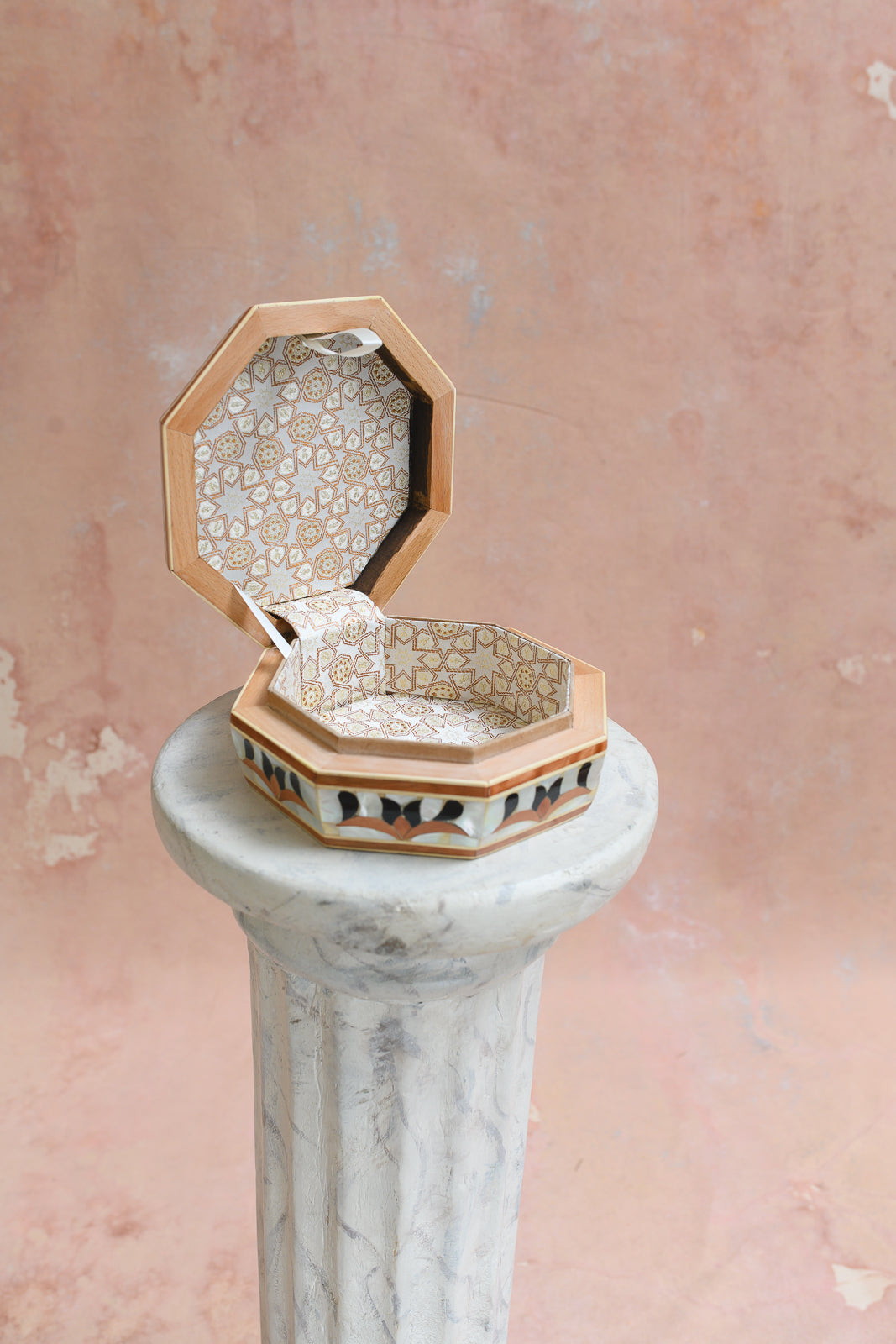 Interior of Damascus octagonal keepsake box lined in gold star-pattern brocade