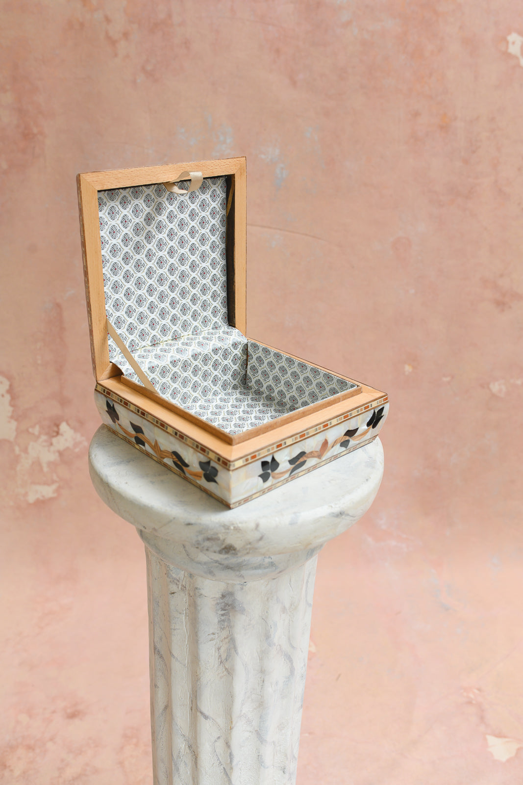 Interior of Damascus keepsake box lined in grey medallion-lattice brocade
