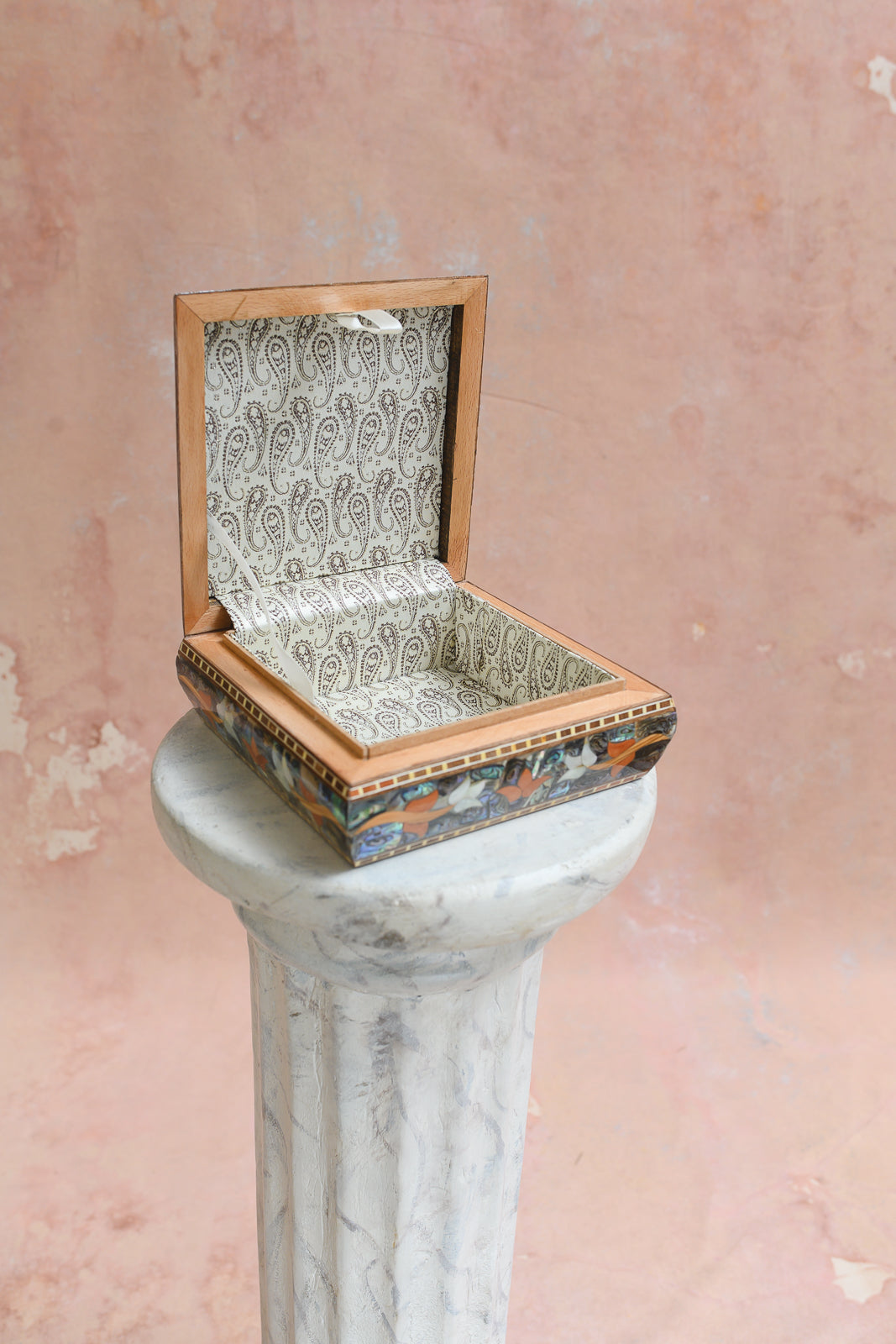 Interior of Damascus keepsake box lined in cream paisley-print brocade