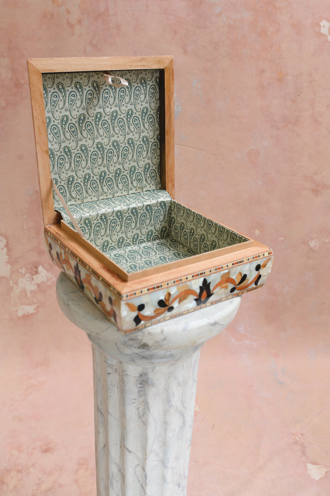 Interior of Damascus keepsake box lined in sage green paisley-print brocade