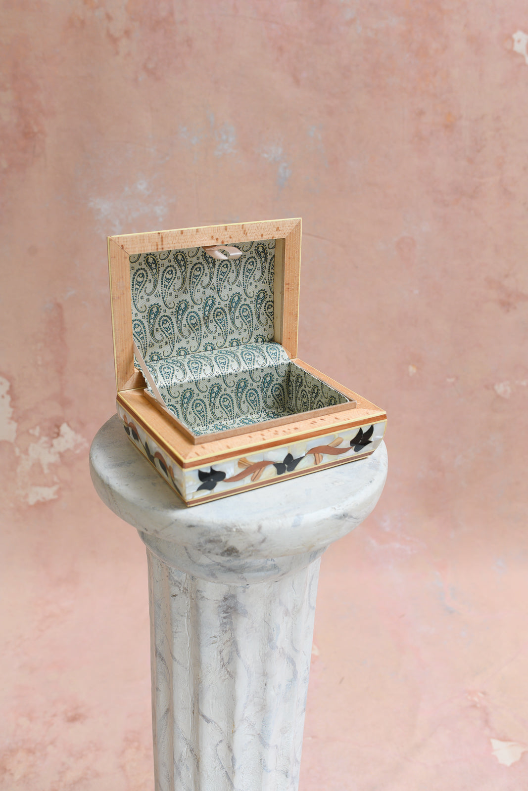 Interior of Damascus keepsake box lined in sage green paisley-print brocade