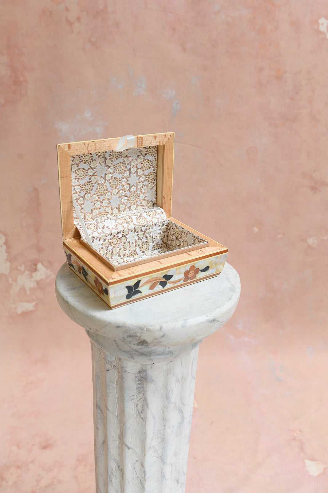 Interior of Damascus keepsake box lined in gold star-pattern brocade