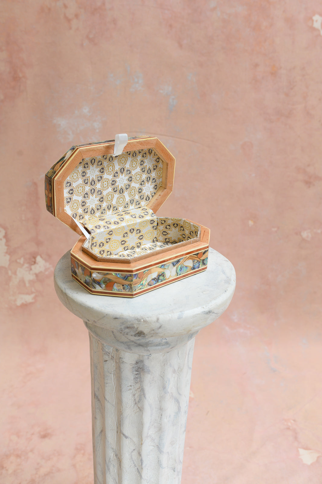Interior of Damascus keepsake box lined in gold star-pattern brocade