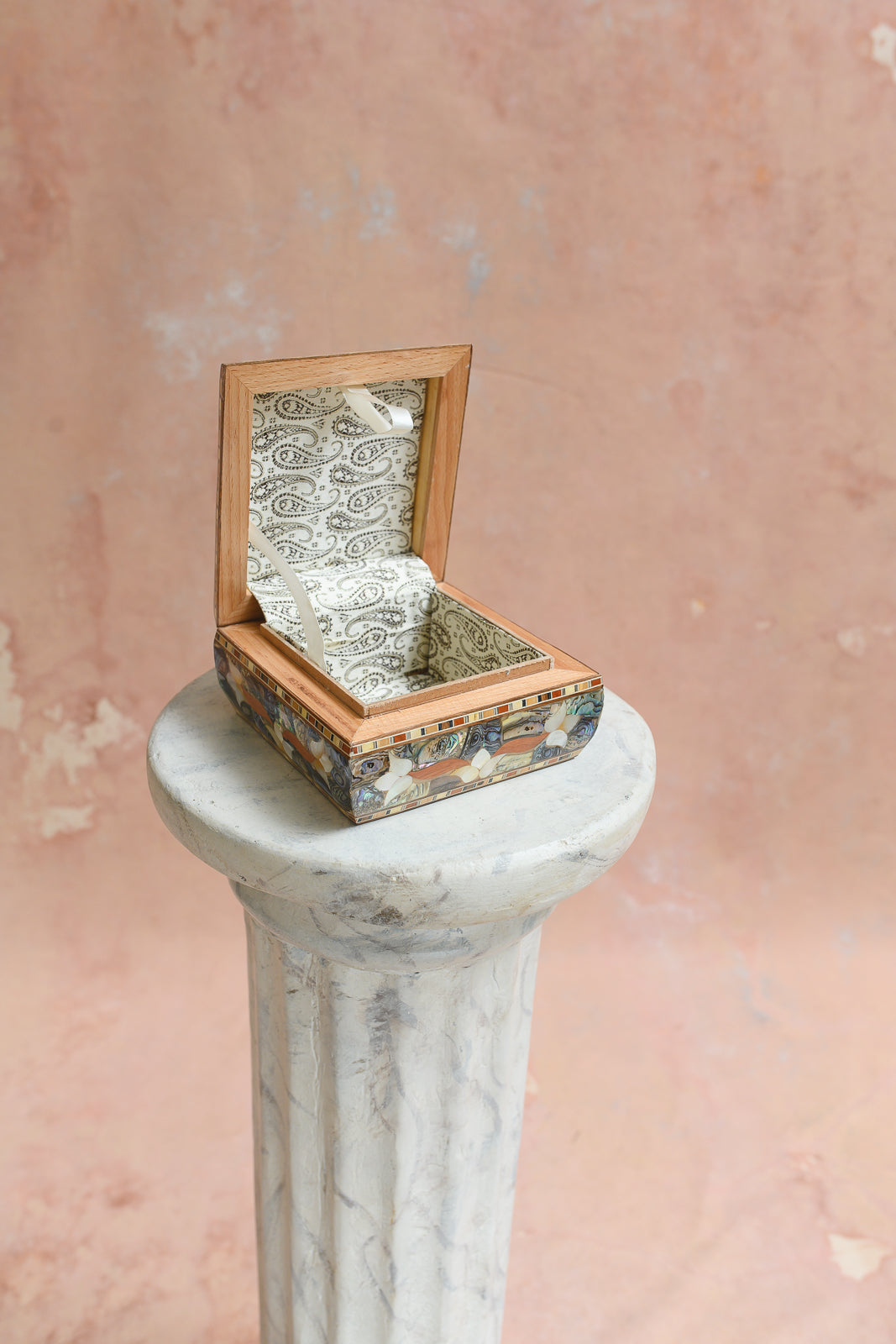 Interior of Damascus keepsake box lined in grey paisley-print brocade