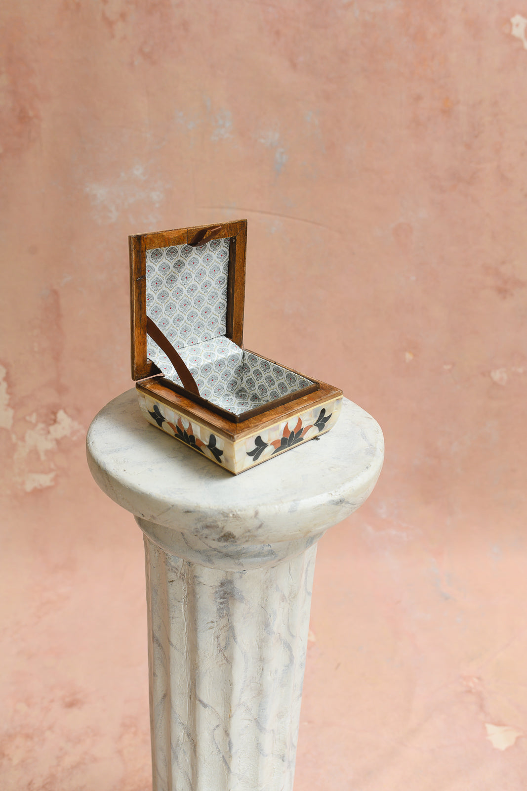 Interior of Damascus keepsake box lined in grey diamond-lattice brocade