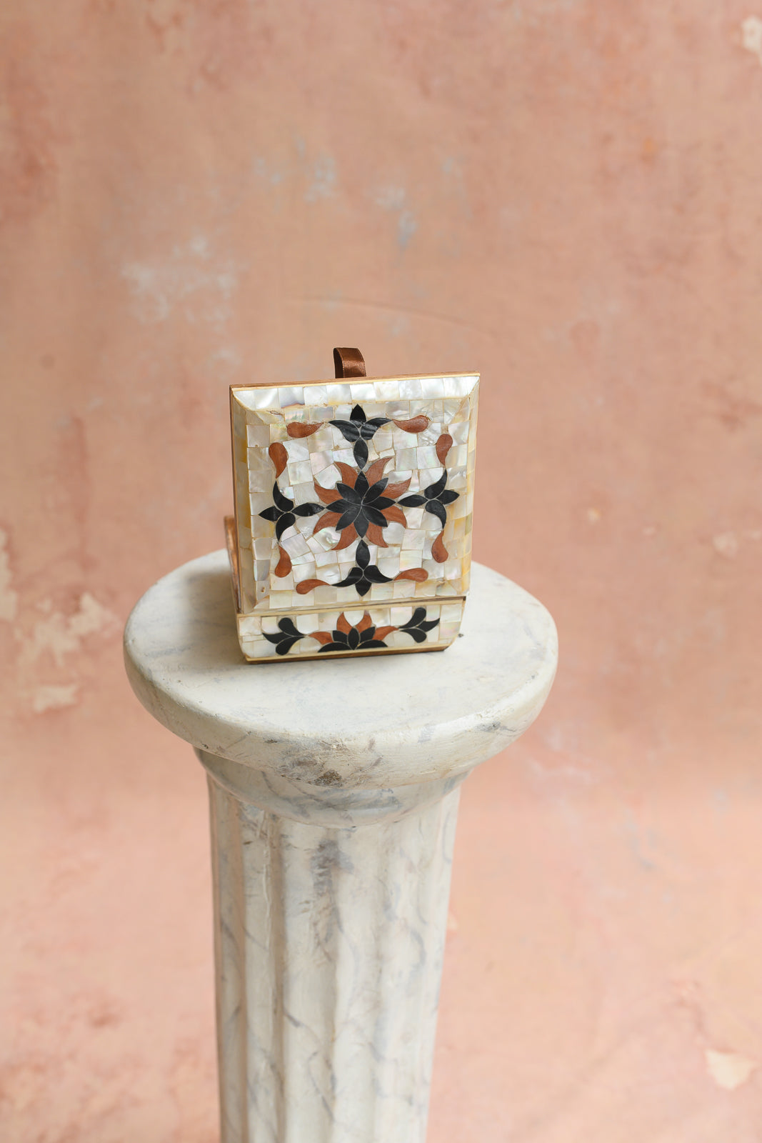 Front view of Damascus keepsake box with black and wood pinwheel star medallion