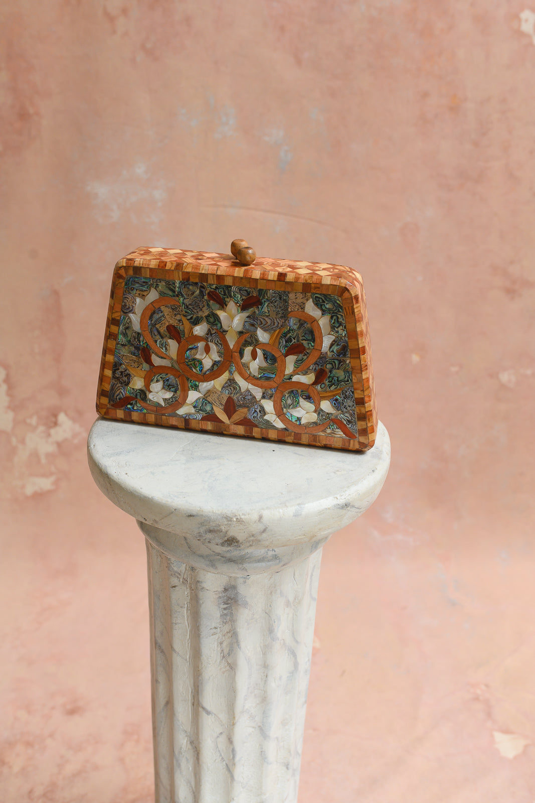 Side view of Damascus box clutch showing wood parquet trim