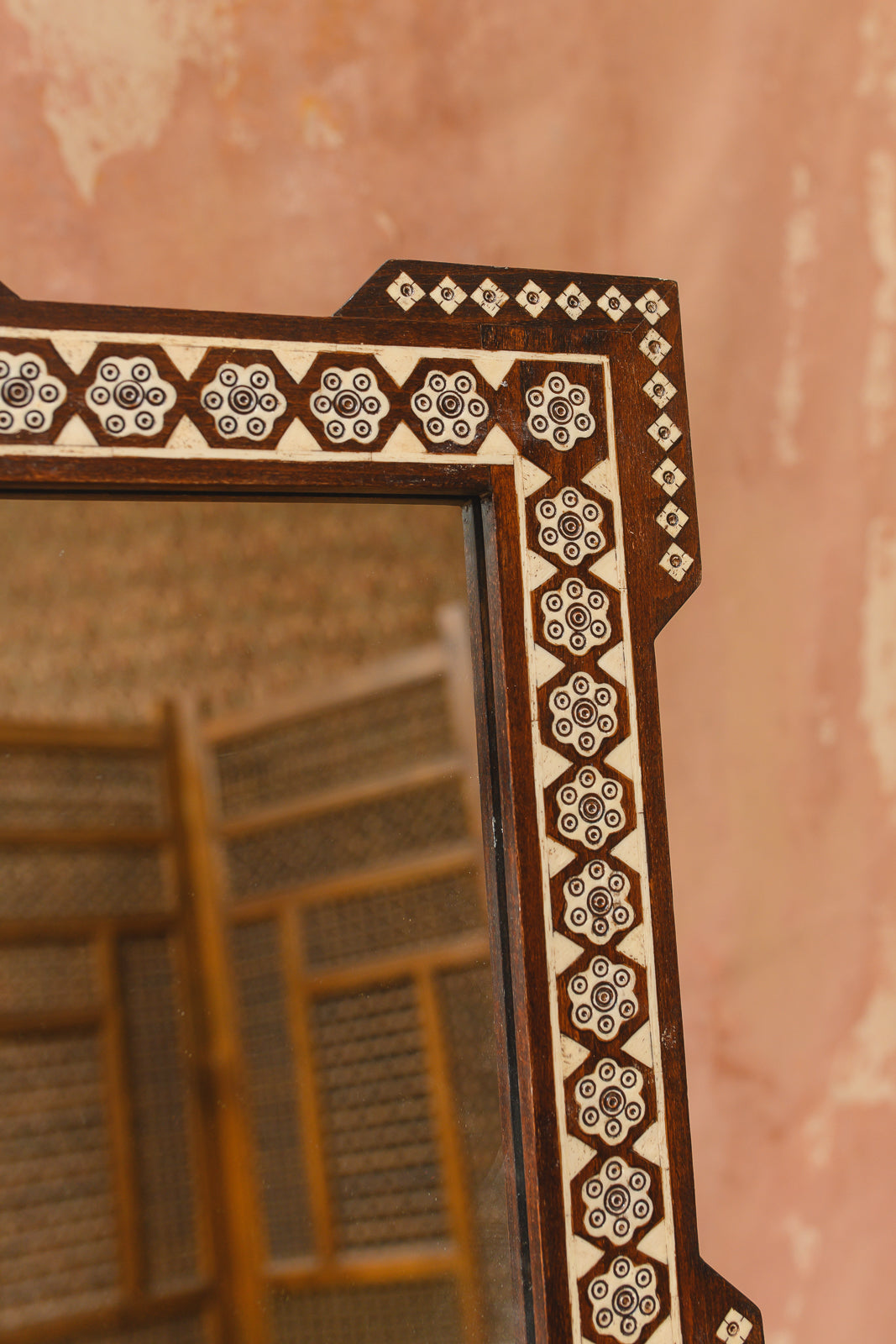 Detail of bone inlay rosette pattern on Damascus mirror corner
