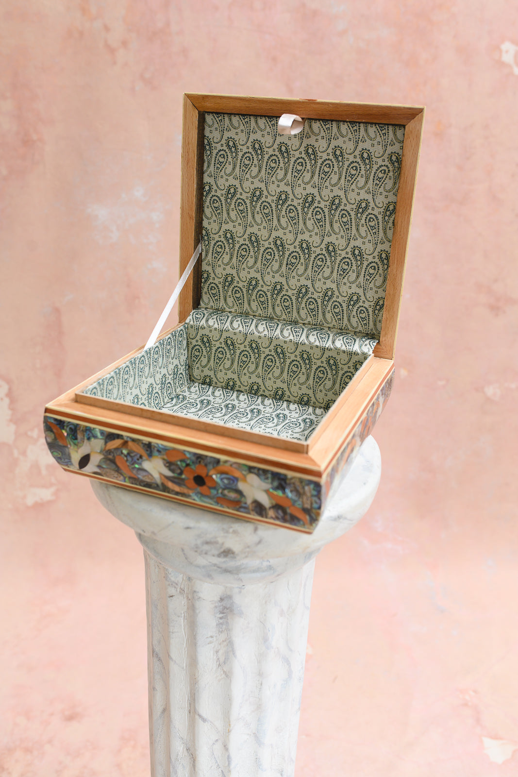 Interior of Damascus keepsake box lined in cream paisley-print brocade