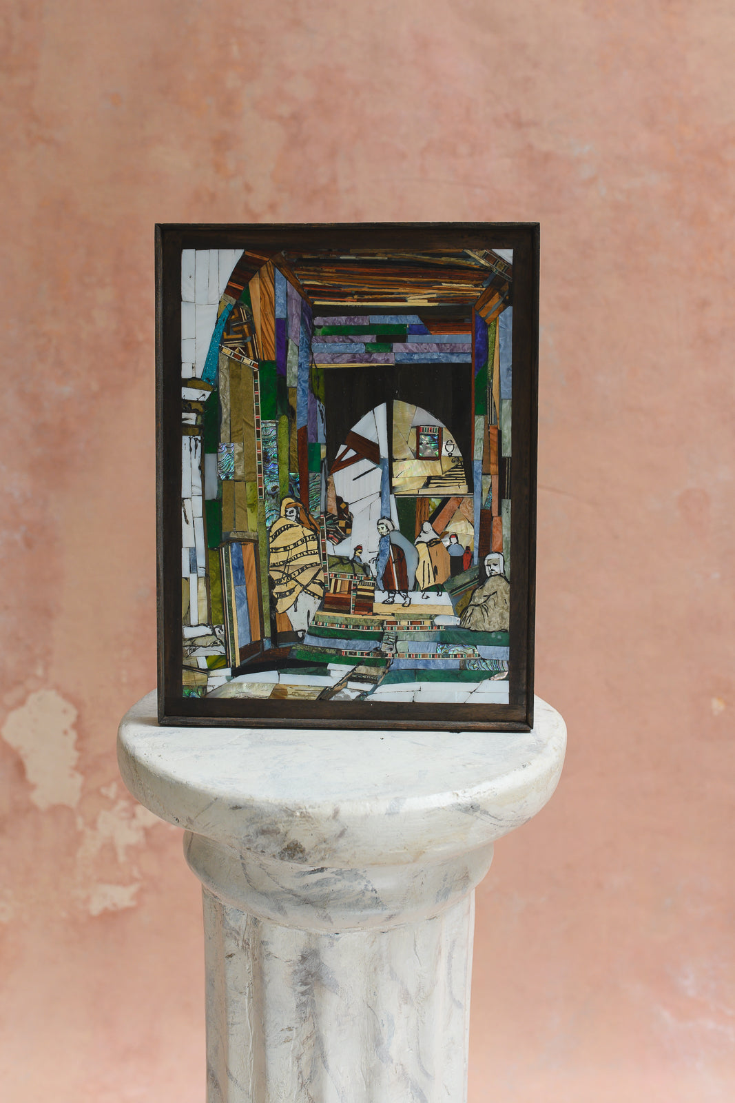 Framed wood and shell mosaic wall panel of a Damascene courtyard scene with figures