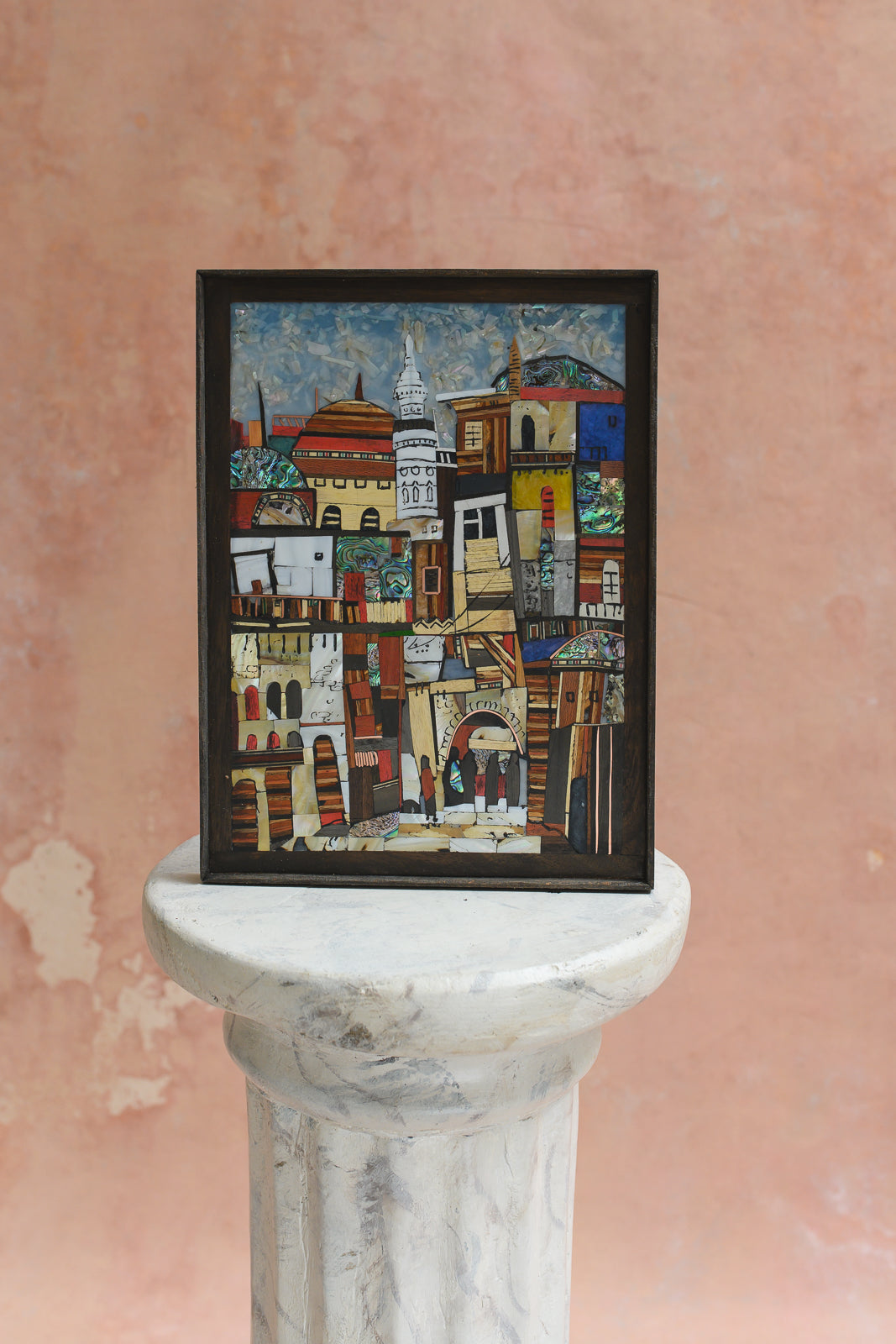Framed wood and abalone shell mosaic wall panel depicting a Damascus cityscape
